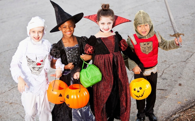 kids dressed in halloween costumes